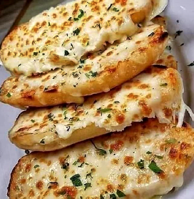 EASY CHEESY GARLIC BREAD This Cheesy Garlic Bread couldn’t be easier to make! It’s quick, outrageously delicious and perfect finger food for any occasion!
